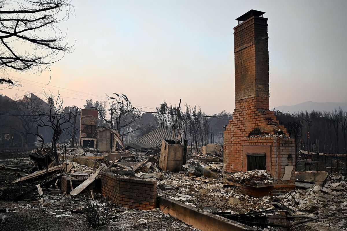 Chimneys stand amid the remains of homes after the passage of the Palisades Fire in Pacific Palisades, California, on January 8, 2025. (AGUSTIN PAULLIER/AFP via Getty Images)