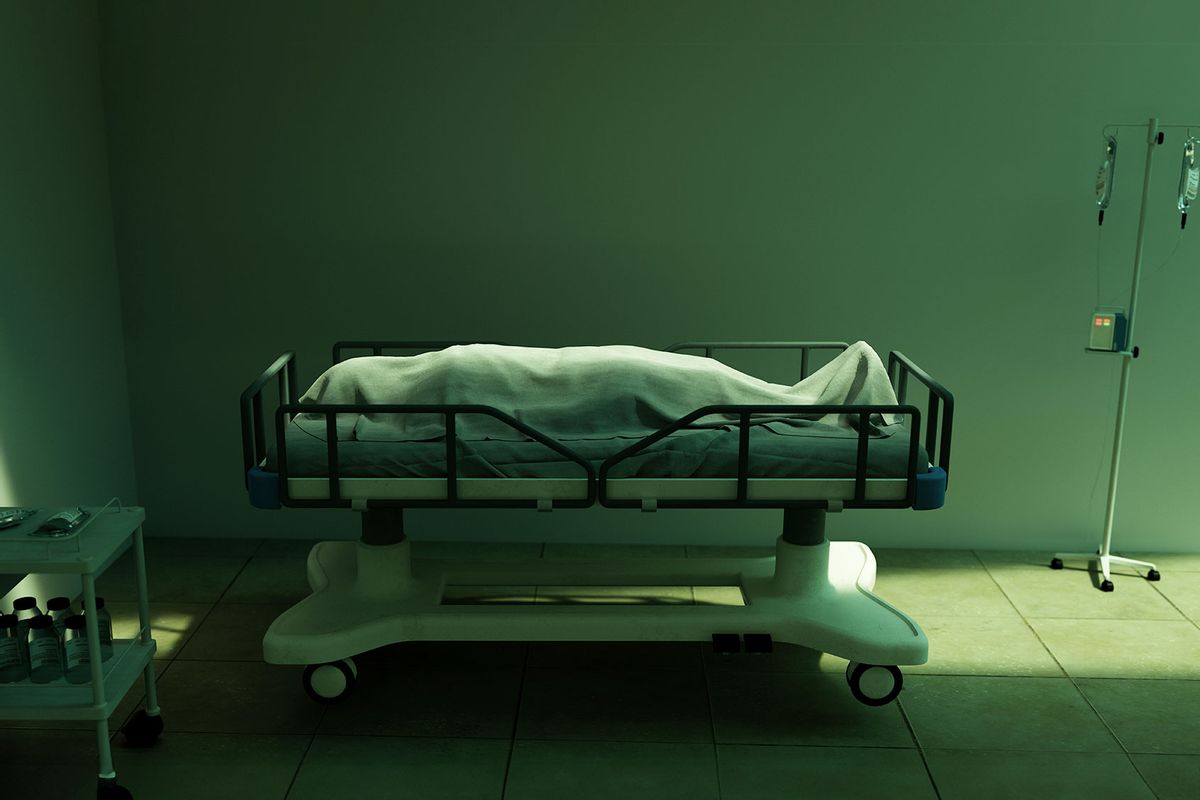 Dead body covered in sheet in hospital (Getty Images/MediaProduction)