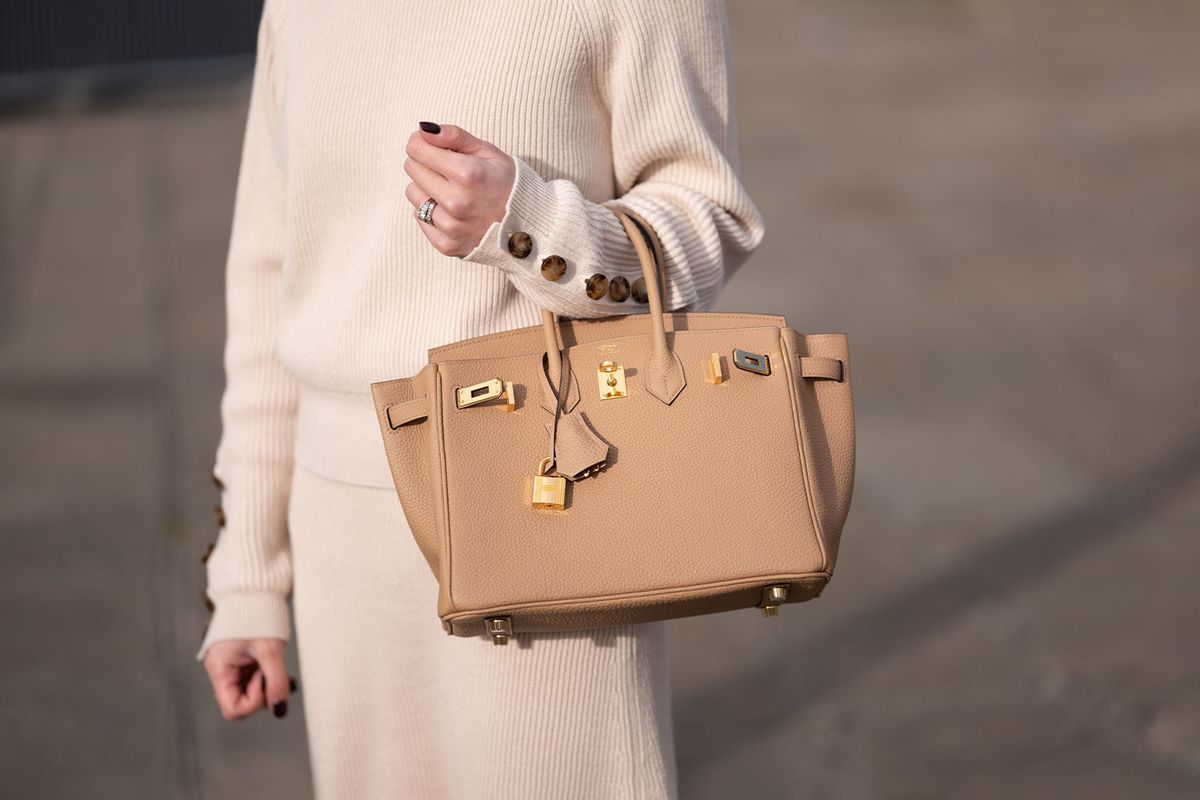 May Berthelot carries a beige leather Birkin handbag from Hermes, during a street style fashion photo session, on March 18, 2023 in Paris, France. (Edward Berthelot/Getty Images)