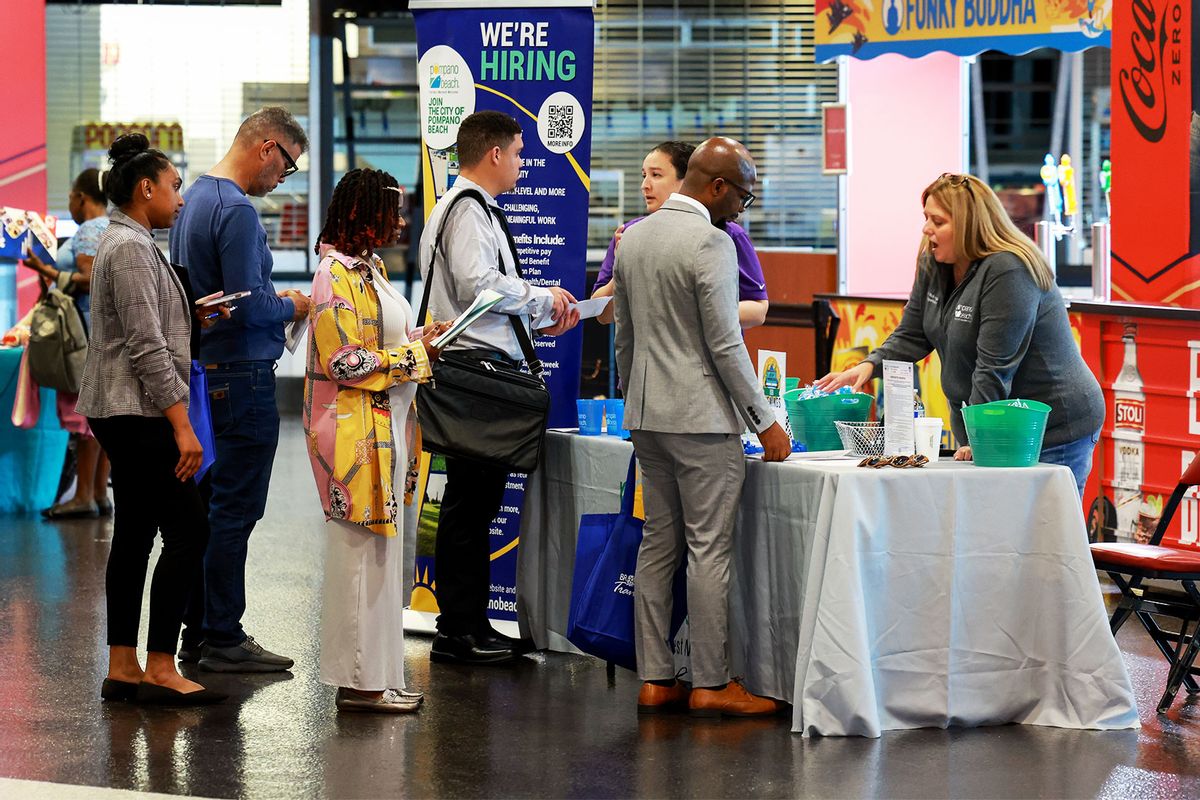 Recruiters for the City of Pompano Beach speak to job seekers during the JobNewsUSA.com South Florida Job Fair held at the Amerant Bank Arena on June 26, 2024, in Sunrise, Florida. (Joe Raedle/Getty Images)