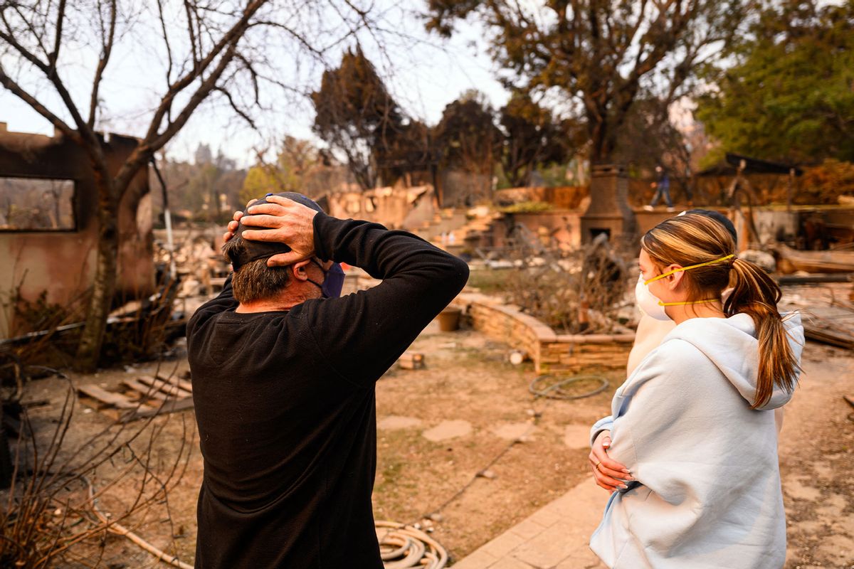 A man reacts as he arrives at his burned home during the Eaton fire in the Altadena area of Los Angeles county, California on January 9, 2025. (JOSH EDELSON/AFP via Getty Images)