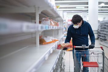 Man shopping supermarket during pandemic