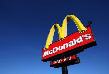 A sign stands outside of a McDonald's restaurant