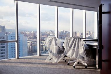 office chairs wrapped in bubble wrap empty office