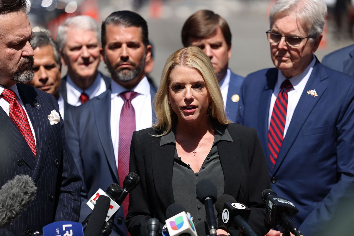 Former Attorney General of Florida Pam Bondi, flanked by Donald Trump Jr (4th L) and Lieutenant Governor of Texas Dan Patrick (R), speaks to the press outside of the courthouse during former US President and Republican presidential candidate Donald Trump's trial for allegedly covering up hush money payments linked to extramarital affairs, in New York City, on May 21, 2024. (CHARLY TRIBALLEAU/AFP via Getty Images)