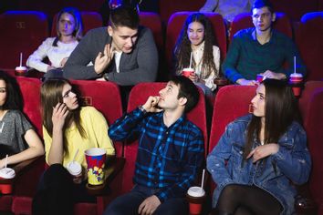 rude movie theater etiquette talking during film man phone