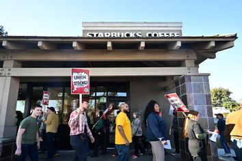 Starbucks workers picket signs protest strike