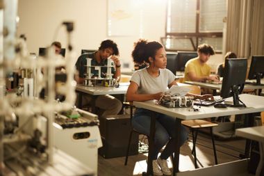 Students in a robotics class; STEM; Woman