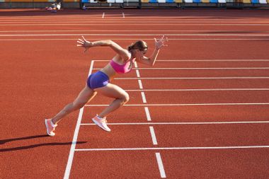 A woman running on a track