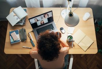 Woman at desk; Video Conference