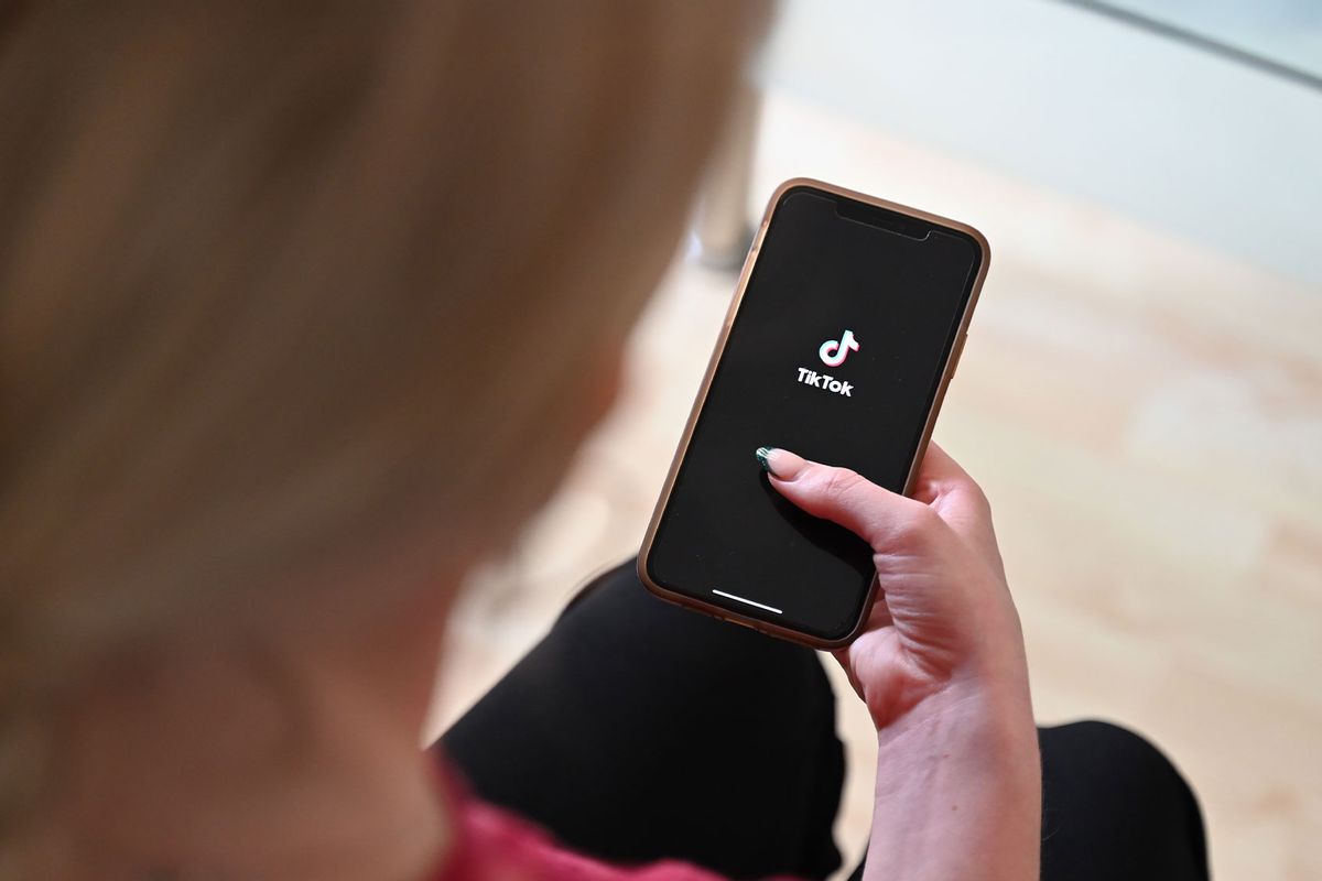 A woman opens Tiktok on her smartphone. (Helena Dolderer/picture alliance via Getty Images)