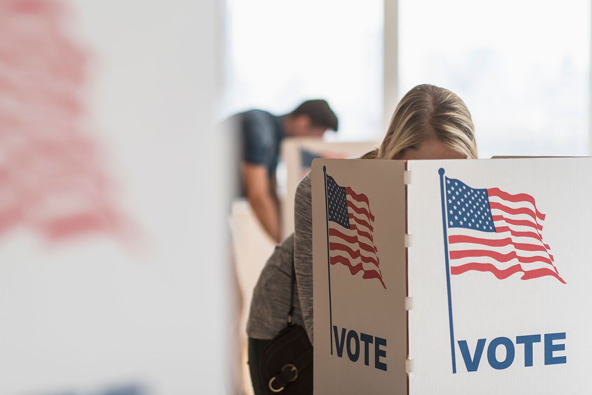 Woman voting on election day (Getty Images/Tetra Images)