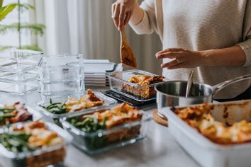 woman weighing food meal prepping prep