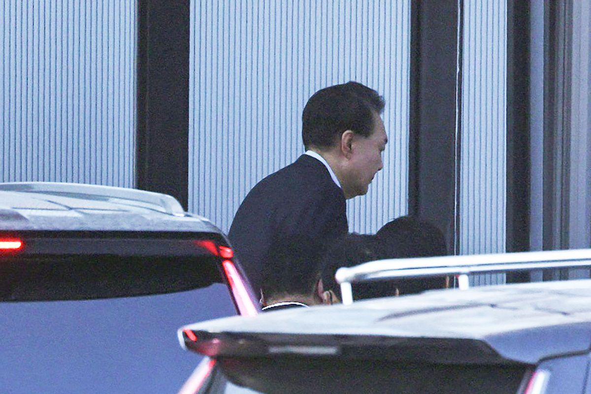 South Korean impeached President Yoon Suk Yeol arrives at the complex building housing the Corruption Investigation Office for High-ranking Officials (CIO) in Gwacheon on January 15, 2025. (STR/KOREA POOL/AFP via Getty Images)