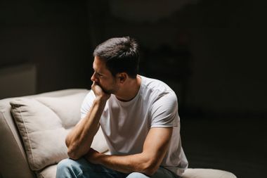 Young man lost in his thoughts